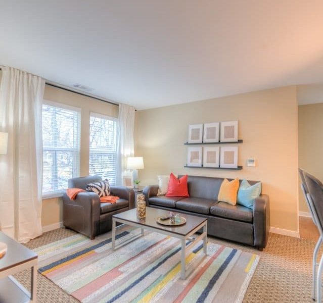 In this gallery image of Uptown East, the Apartments of Valparaiso, Living room with furniture included