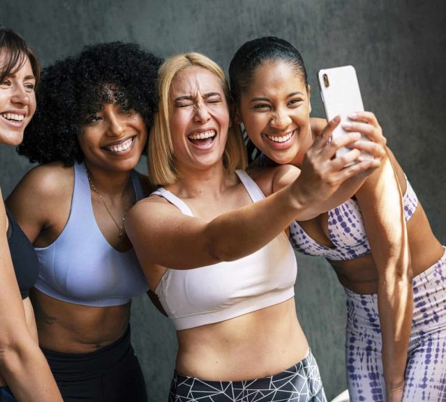 Cheerful sporty women taking a selfie Healthy Amenities. Finding an apartment in Valparaiso should include a tour of the community for safety considerations